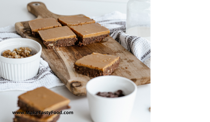 chocolate peanut brownies sliced on a bread board