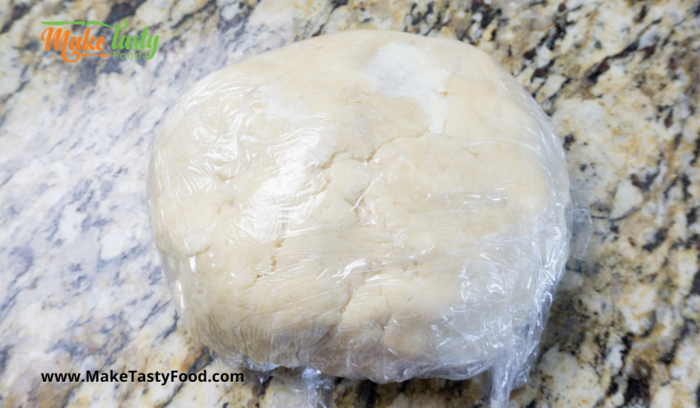the dough wrapped in plastic and left in a fridge for an hour