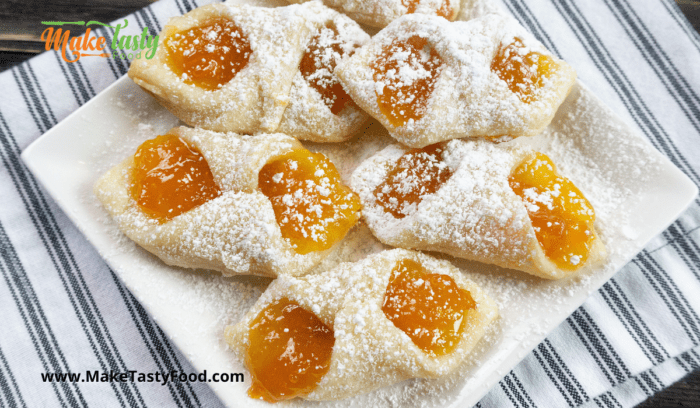 a plated sugar dusted jam cookies