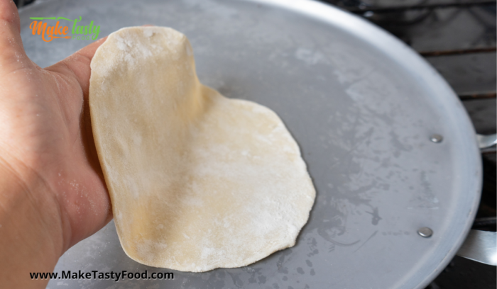 cooking the tortilla on a skillet
