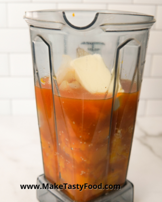 adding all the ingredients in the blender for this wonderful butternut soup