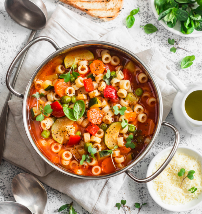 a pot of minestrone soup ready for serving