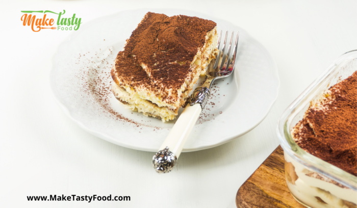 very tasty tiramisu tart to eat with a fork and dished on a plate
