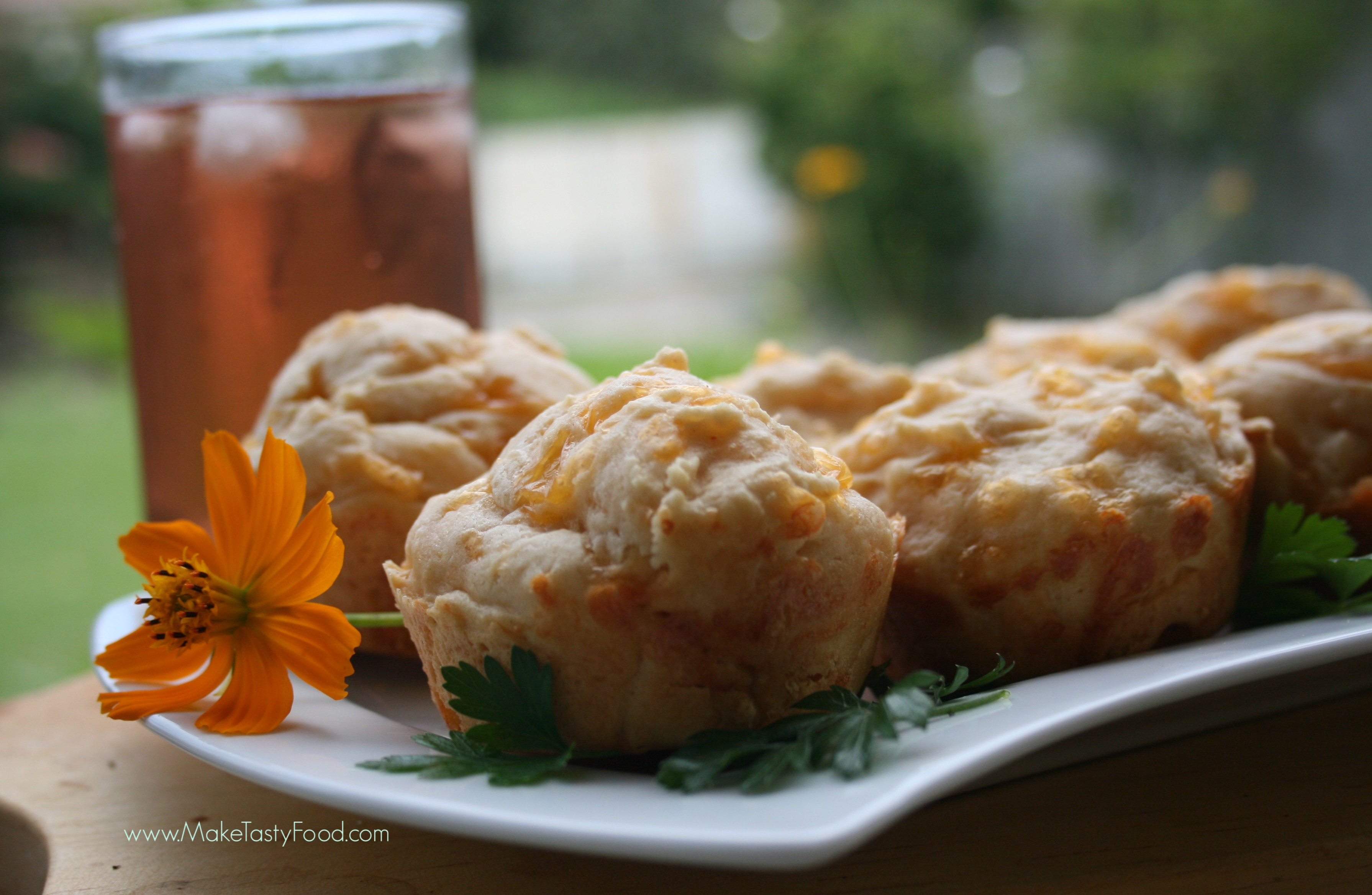 iced tea and cheese scone on a serving plate