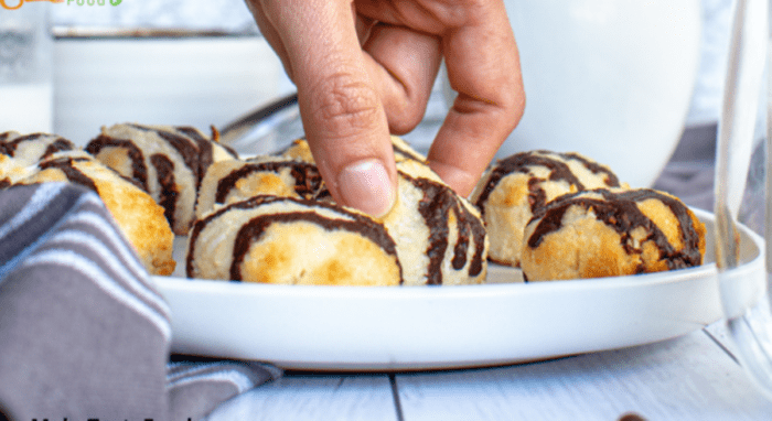 Coconut macaroons drizzled with chocolate are so divine, make a few and store them to have with sudden unexpected visitors for tea or coffee.
