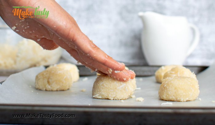 macaroons made with coconut being pressed down