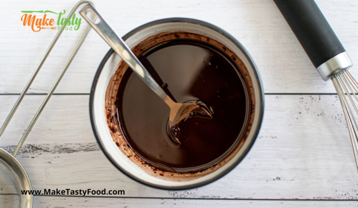 chocolate in a bowl mixed to drizzle on macaroons