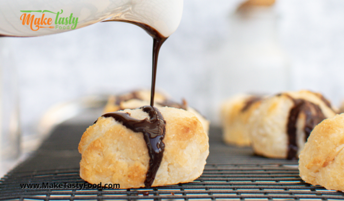 drzzling chocolate over the coconut macaroons