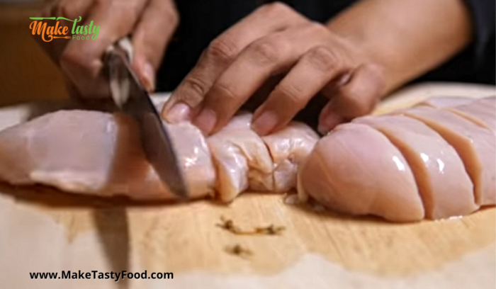 cutting up of chicken breast for kebobs