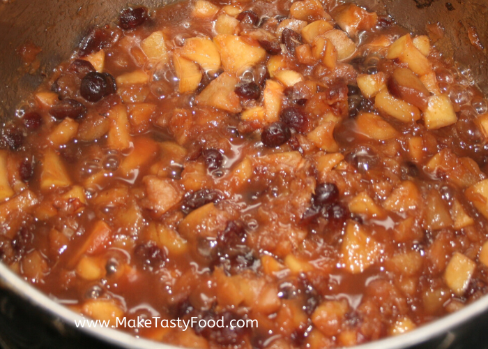 raisons added and pears tender in a pot