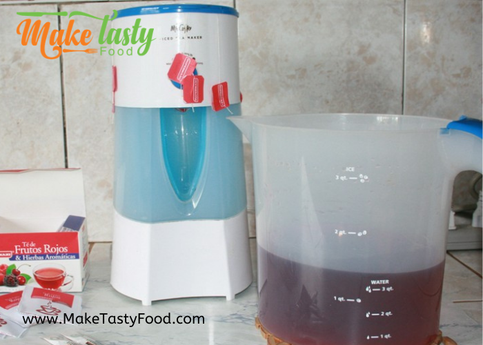 iced tea maker with fruity tea being made
