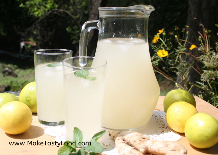 a jug and two glasses of thirst quenching ginger beer