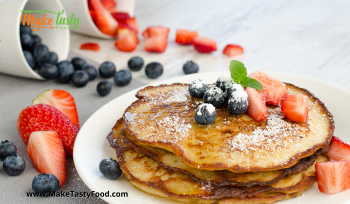 banana pancakes with love berries and fruit for breakfast