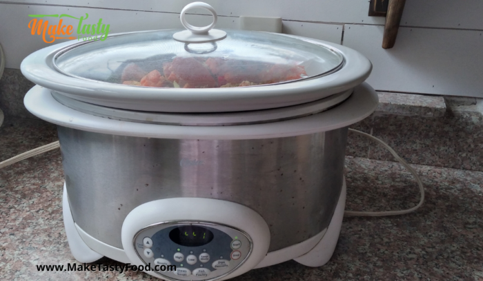 a slow cooker set to cook