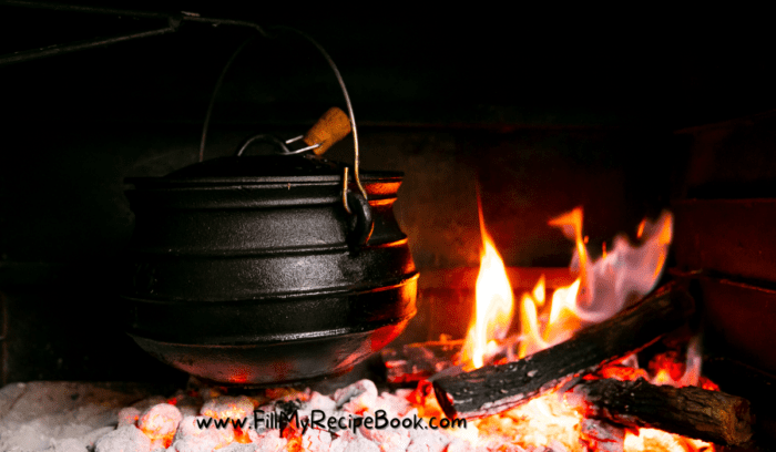 a potjie pot on the coals cooking