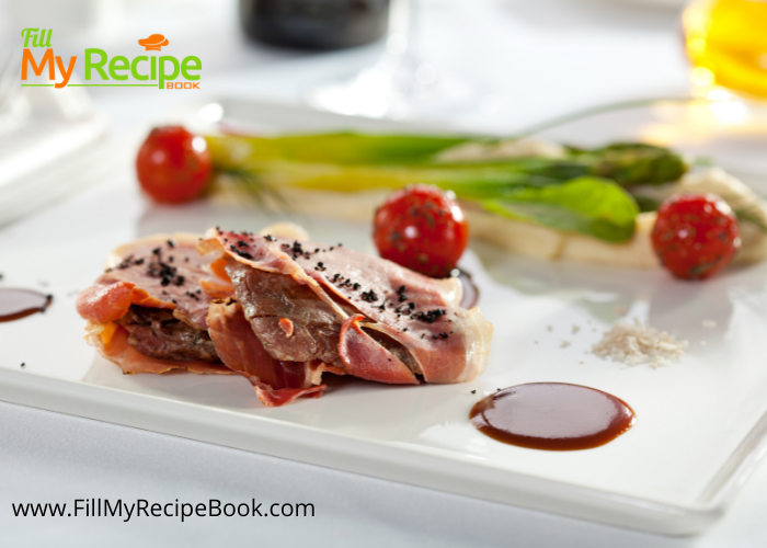 Bacon Wrapped Pork Tenderloin recipe and sauce served with sautéed cherry tomatoes and asparagus on creamy basil dressing for a gourmet meal.