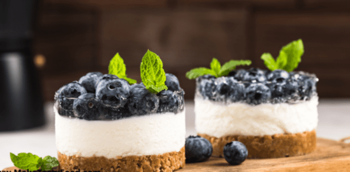 Mini Blueberry Cheesecake Tartlets are easy and homemade with a biscuit base topped with creamy cream cheese filling topped with blueberries.