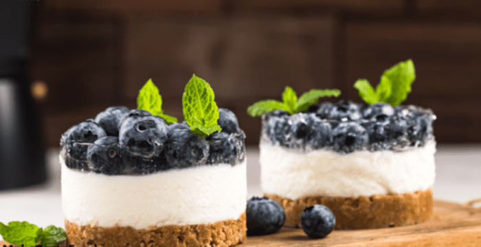 Mini Blueberry Cheesecake Tartlets Recipe. Easy homemade oven bake with a biscuit base and a creamy cream cheese filling with blueberries on.