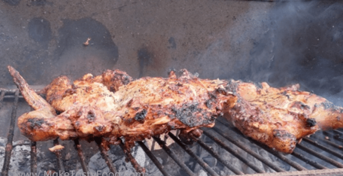 Juicy Grilled whole Lemon Chicken. Grilled on outside braai or barbecue this recipe of a spatchcock chicken seasoned with fresh lemon juice.