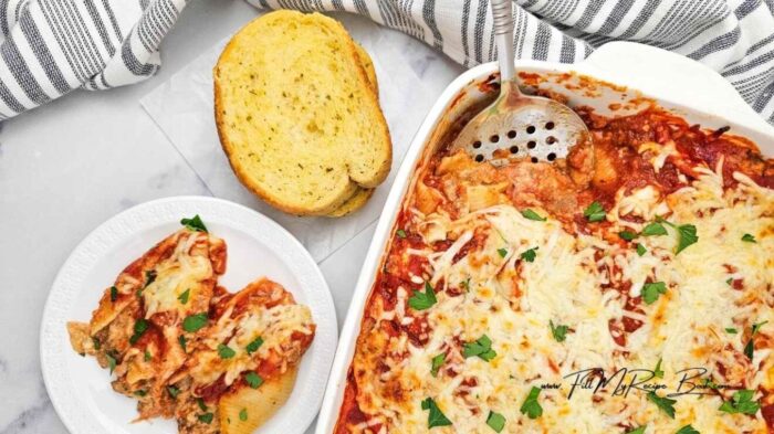 A cozy creamy Italian sausage stuffed shells recipe with three cheeses and marinara is the ultimate comfort food for dinner on busy nights.