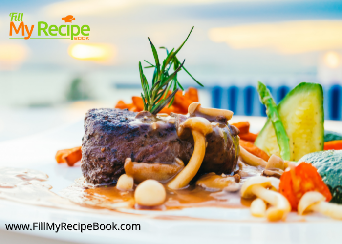 Filet Mignon in Red Wine Sauce seared and adding mushrooms and vegetables served as a fine dining meal.
