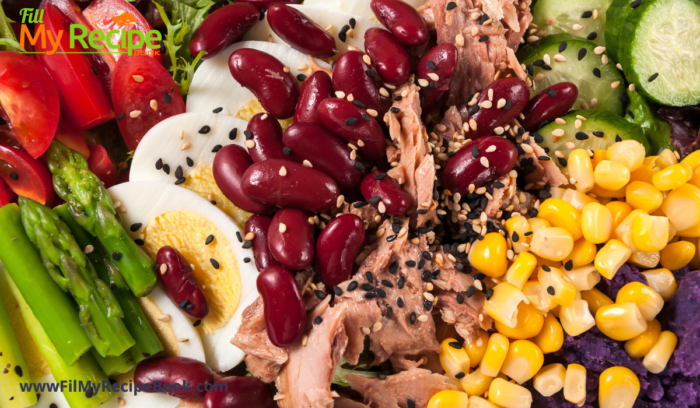 A Filling Homemade Chicken Salad with lots of proteins such as beans boiled egg and chicken.