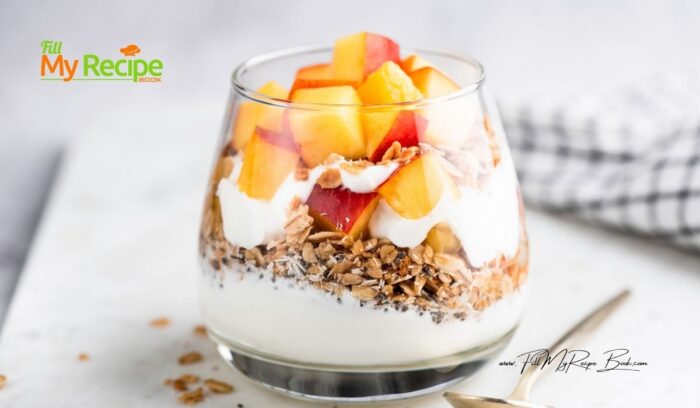 Healthy Peach Yogurt Parfait Recipe with granola, flax seeds, and fresh peaches, that are perfect for a quick, protein packed breakfast.