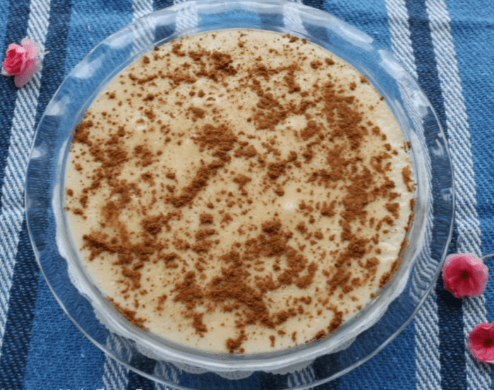 Homemade Milk Tart that is also a no bake dusted with cinnamon for a tea for mothers day
