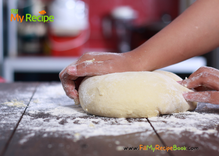 mixing the two ingredient dough that has greek yogurt and flour.