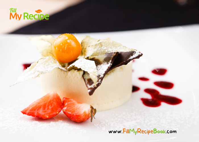 White Chocolate Panna Cotta with chocolate castor sugar coated leaves. A golden gooseberry and sliced strawberry for decoration with sauce.