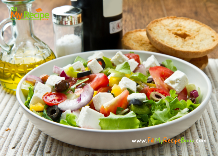 Best Greek Salad Recipe with a dressing, tossed together with lettuce. An easy and crunchy cold side dish in a bowl for braai, barbecue meals.