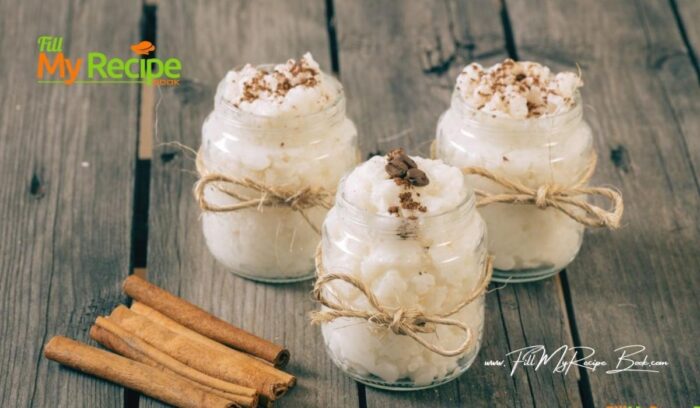 Easy Rice Cooker Rice Pudding recipe idea. So simple, made with milk and served with some cinnamon and nuts for a delicious dessert.