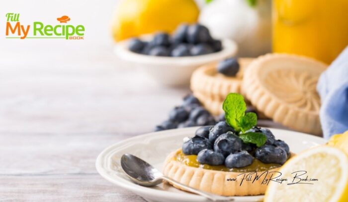 A mini Lemon Curd and Blueberry Tartlets Recipe. Oven baked dessert with shortbread crusts, filled with tangy lemon curd and blueberries.