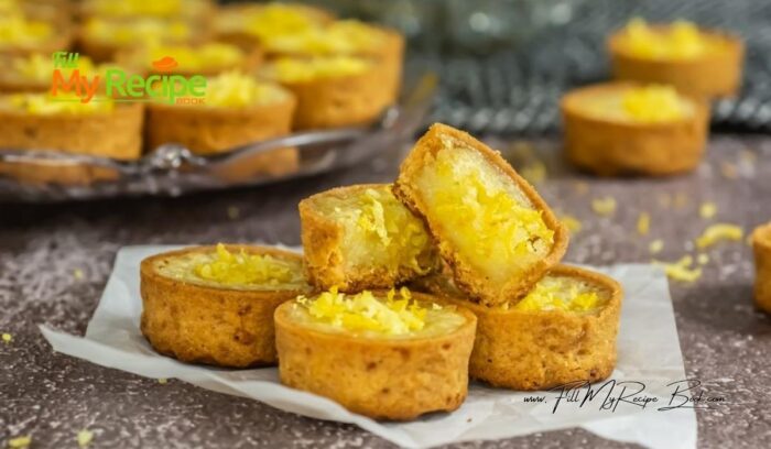 Mini Lemon Custard Tart Recipe idea. Oven Baked in pre bought crusts with sour cream and egg filling, garnished with lemon zest for dessert.