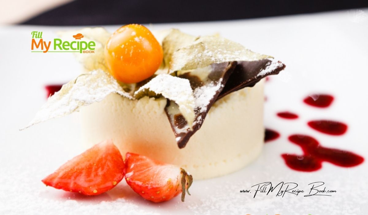 White Chocolate Panna Cotta with chocolate castor sugar coated leaves. A golden gooseberry and sliced strawberry for decoration with sauce.