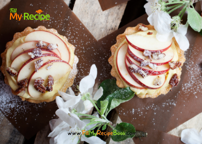 Mini Apple Cream Tartlets with baked shortbread pastry for tarts. Filled with creamed apple sauce topped with slices of fresh apples.