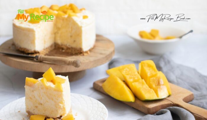 Easy Mango Cheesecake Dessert recipe. No gelatin, cream cheese and lemon and biscuit base. No Bake creamy filling, decorated mango slices.