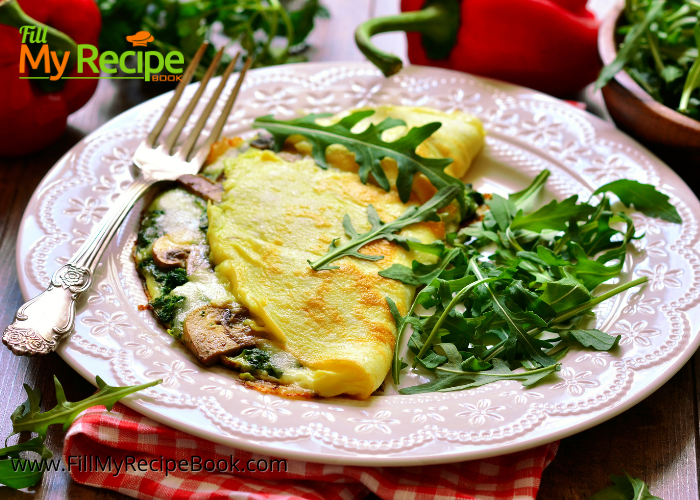 Healthy Mushroom and Spinach Omelet. A breakfast meal made with healthy ingredients such as spinach and mushrooms and cheese.