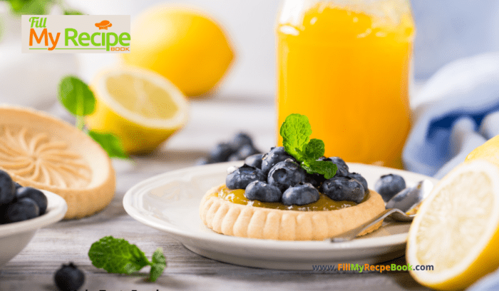 A mini Lemon Curd and Blueberry Tartlets Recipe. Oven baked dessert with shortbread crusts, filled with tangy lemon curd and blueberries.