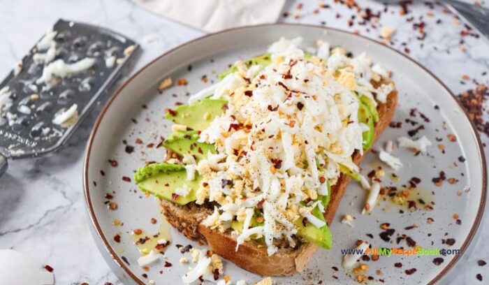 Nutritious Avocado Grated Egg on Toast recipe idea has a crispy bite with buttery avocado and grated boiled egg spiced with lemon pepper.