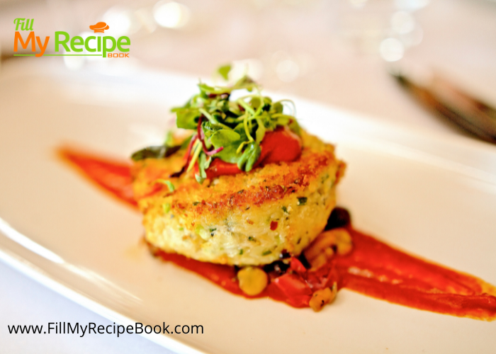 Crab Cake with Tomato Butter Sauce recipe plated for a gourmet fine dining dinner. Easy dish to serve for a meal set on corn salad.
