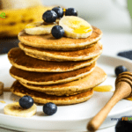 Easy Banana Oat Pancake Recipe to make with ripe bananas and oats. Quick healthy mix with egg, vanilla and cinnamon for a breakfast meal.