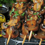 Grilled Sliced Button Mushroom Kebabs recipe idea for a braai or barbecue. A healthy and tasty side dish or appetizer on skewers for a meal.