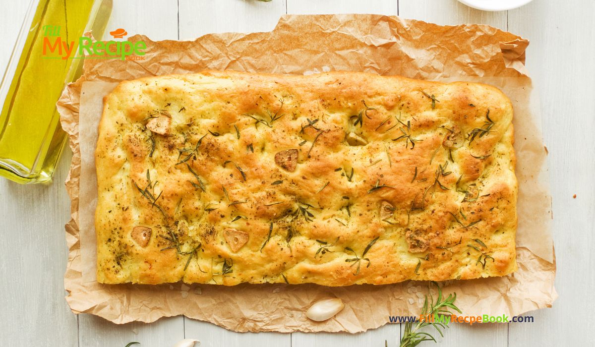 Garlic Rosemary Focaccia Bread Machine Recipe. A bread machine dough for an easy oven bake side with fresh rosemary and herbs topping.