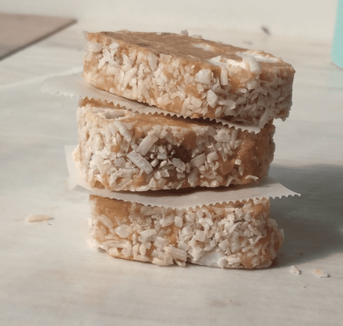 Marshmallow Fridge Cake Biscuits recipe idea for a dessert. A No Bake stove top recipe with biscuit and condensed milk, coconut coated.