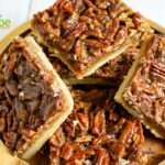 Easy Shortbread Pecan Bars recipe. A shortbread crust topped with pecan nuts, honey, cream and brown sugar for a healthy snack bar.