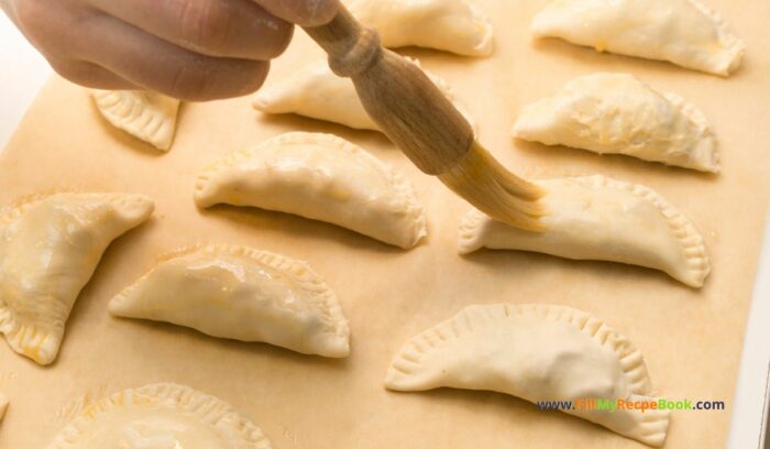 A Homemade Savory Hand Pies recipe idea that is flaky from the puff pastry with a tasty filling of saucy ground beef, veggies and potato.