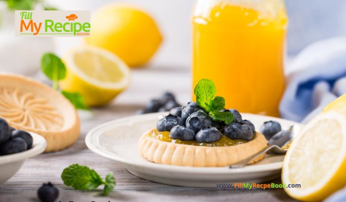 A mini Lemon Curd & Blueberry Tartlets Recipe. Oven baked dessert with shortbread crusts, filled with tangy lemon curd with blueberries.