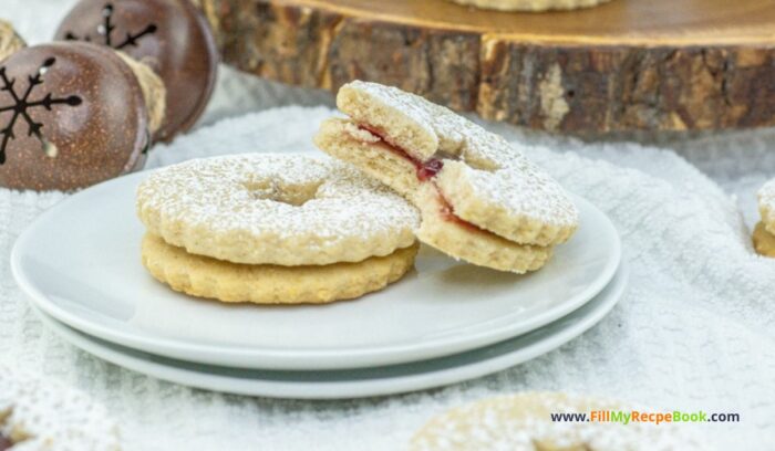 Homemade Linzer Raspberry Jam Cookies treats combine rich buttery goodness with a hint of almond, filled with raspberry jam for holidays.