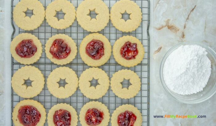 Homemade Linzer Raspberry Jam Cookies treats combine rich buttery goodness with a hint of almond, filled with raspberry jam for holidays.